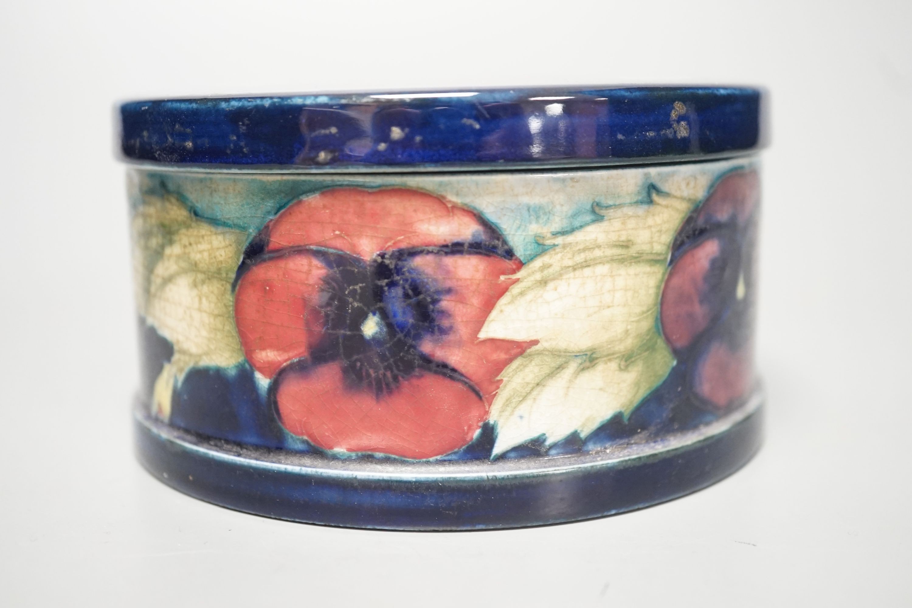 A Moorcroft pansy pattern circular box and cover, diameter 12cm